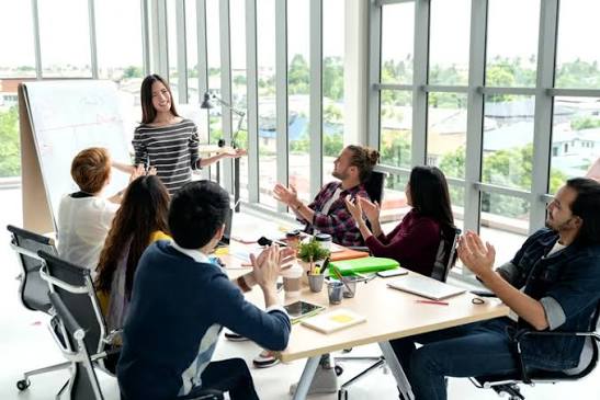 A facilitator leading an AI readiness training session for a leadership team